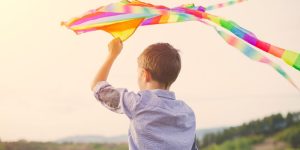 mindful autism learning and research boy flying kite autism