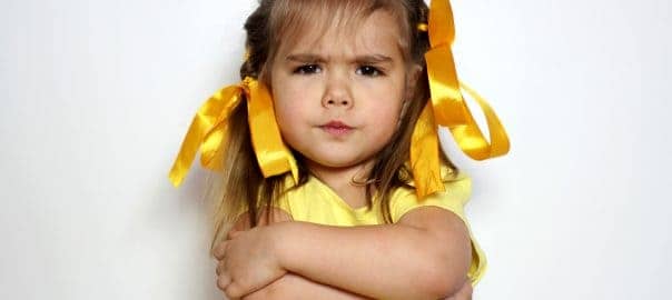 If your child resists meditation: the best way to meditate - girl child with arms crossed