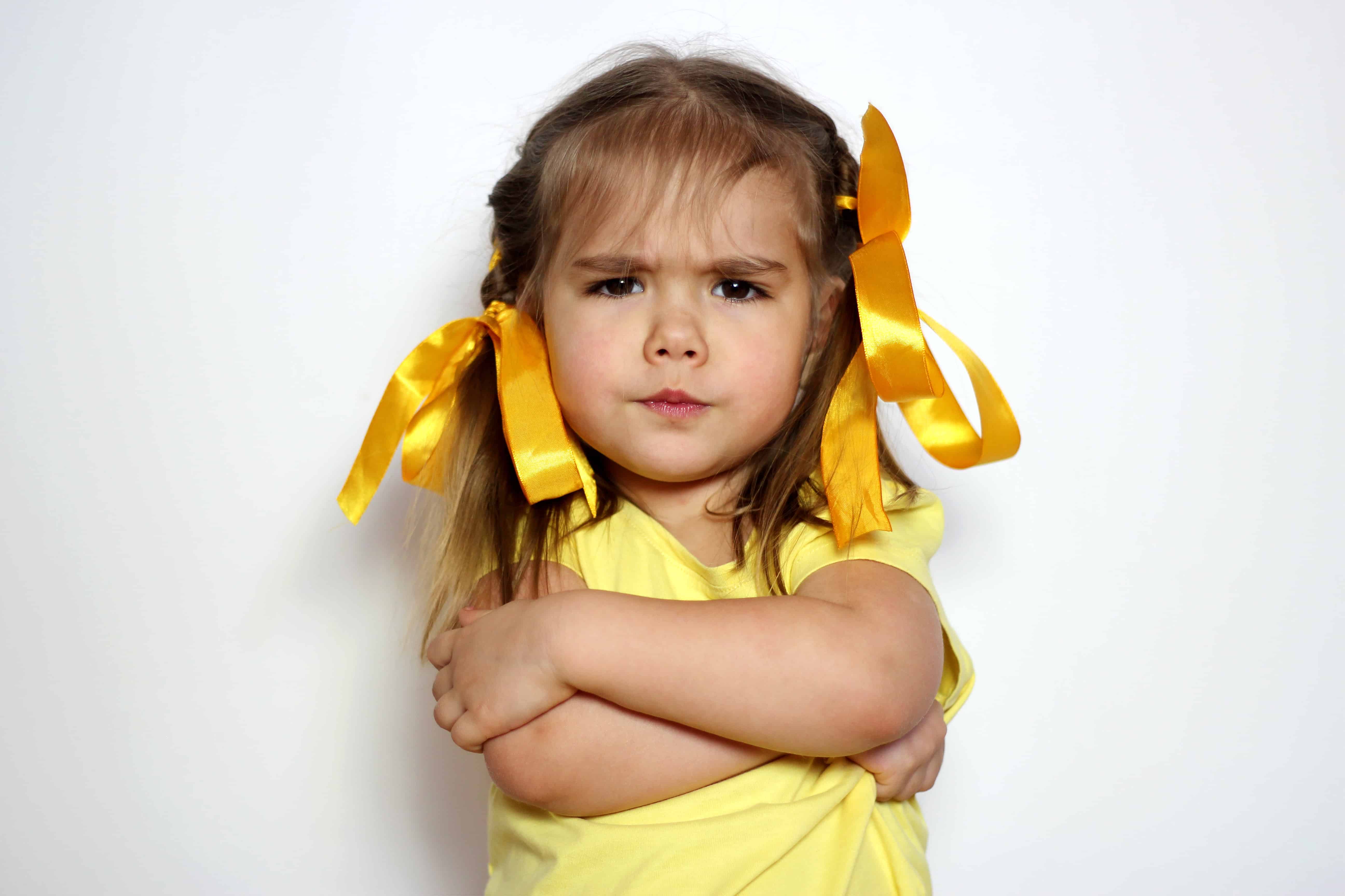 If your child resists meditation: the best way to meditate - girl child with arms crossed