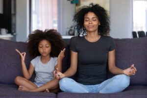 mother and daughter meditating - mindful parenting