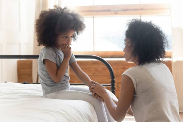 anxious child comforted by parent