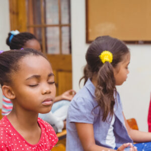 mindfulness in schools - children sitting meditating