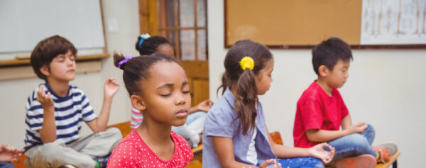 mindfulness in schools - children sitting meditating