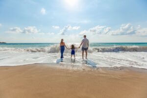 family on beach - mindful holidays - meditation
