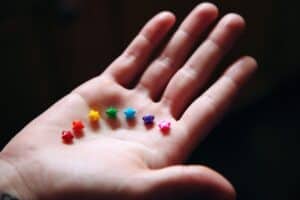 hand filled with colour beads - international kindness day ideas