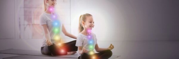 Confidence and creativity - advanced techniques woman and girl sitting meditating - with view of their chakra energy centres Energy awareness to help with SEN